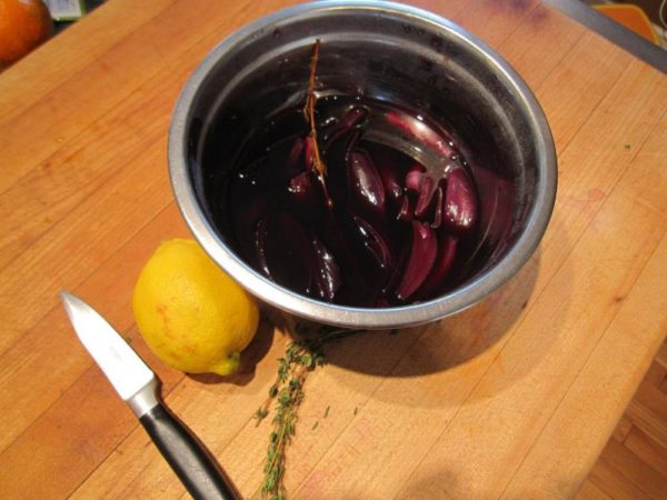 Shallots marinating in blueberry juice