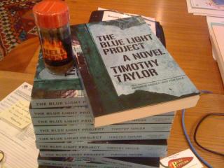 Stack of Blue Light Project books with Soft Skull galleys plus hot pepper
